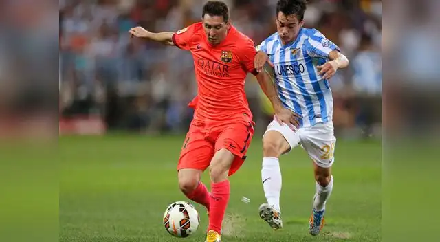  Málaga vs. Barcelona: Lionel Messi lucha por anotar.