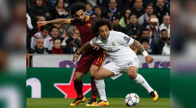 Real Madrid vs. AS Roma: Marcelo disputa el balón con Mohamed Salah. Real Madrid vs. AS Roma: Marcelo disputa el balón con Mohamed Salah.