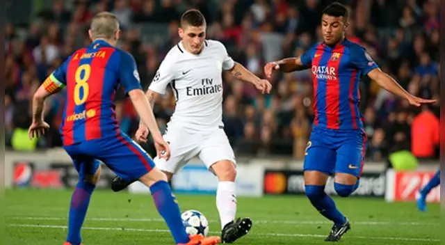 Marco Verratti ensaya un disparo ante la presencia de Rafinha e Iniesta.