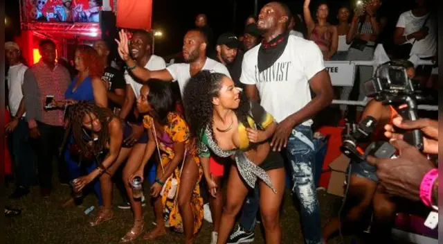 Usain Bolt  fue 'ampayado' bailando de una forma muy peculiar con una mujer en Trinidad y Tobago