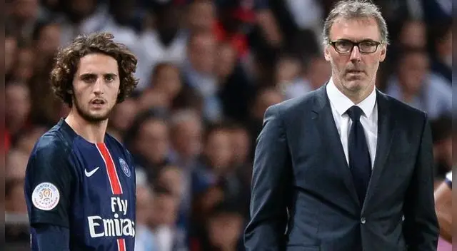 Adrien Rabiot y Laurent Blanc durante un partido del PSG.