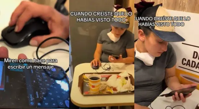 Joven se luce usando un mouse para poder escribir en su celular Joven se luce usando un mouse para poder escribir en su celular