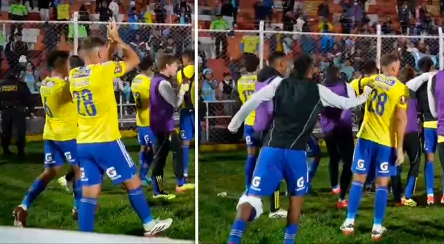Joao Grimaldo empujó a Nicolás Pasquini durante celebración de Sporting Cristal. Joao Grimaldo empujó a Nicolás Pasquini durante celebración de Sporting Cristal.