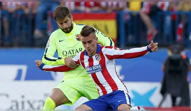 Gerard Piqué y Antoine Griezmann, durante un Atlético-Barcelona.