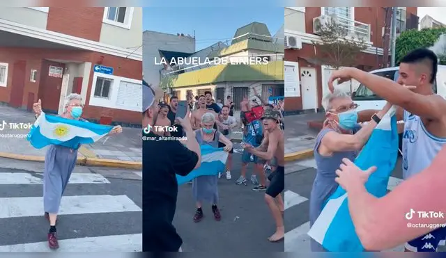 Adulta mayor celebra en la calle junto a la hinchada de Argentina.