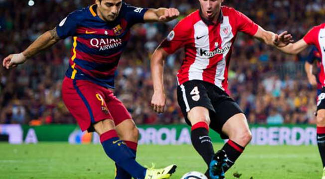 Aymeric Laporte marca a Luis Suárez en un Barcelona vs. Athletic de Bilbao.