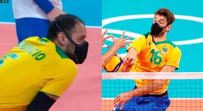 Dos jugadores de vóley de Brasil usan mascarilla mientras compiten en Tokio2020.